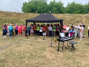 Choir sings under a canopy